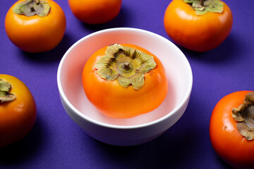 persimmon fruit on a plate