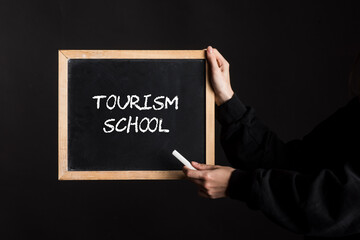a tourism school or hotel school sign