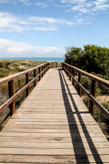 Fototapeta na wymiar Wooden walkway to the beach in the morning in Spain