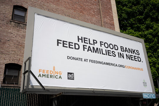 Portland, OR, USA - Apr 27, 2021: Feeding America Billboard Is Seen In Downtown Portland, Oregon, During The COVID Pandemic. Feeding America Is A Nonprofit With A Nationwide Network Of Food Banks.