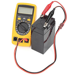 Testing an acid rechargeable battery with a measuring instrument isolated on white background