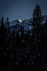 Snow Covered Mountain Peak at Sunset in the Winter Time