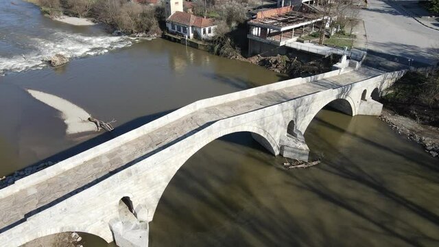 Aerial view of Kadin most - a 15th-century stone arch bridge over the Struma River at Nevestino, Kyustendil Province, Bulgaria