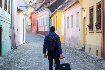 man traveler with mask in a city citybreak after coronavirus pandemic