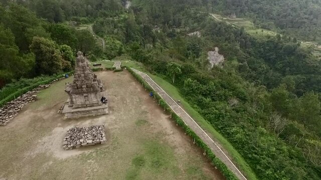 Cinematic aerial footage view of isolated Hindu temple in top of Bandungan hill, Central Java, Indonesia