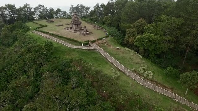 Hindu temple aerial footage dolly shot view from drone flying backward slowly