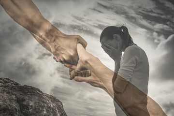 Sad distressed woman getting a helping hand 