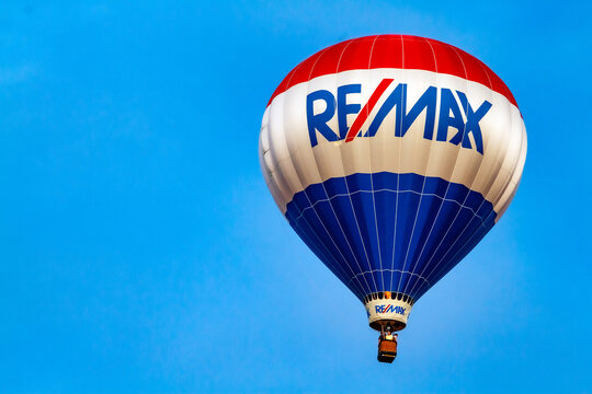 RE/Max Hot air balloon isolated in clear blue sky. Isolated. Room for text