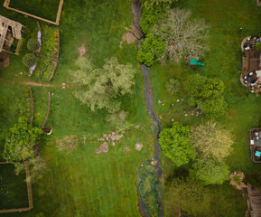 Aerial view of a creek running through lawns of houses in a neighborhood of Lexington, Kentucky