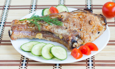 Meat and Vegetables. Roasted Pork with cucumbers and tomatoes. Ribeye Steak