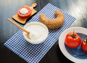 Breakfast. Cream Cheese, Tomatoes and Grain Bagel