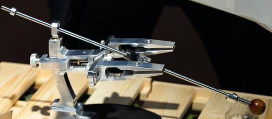 Manual machine for sharpening knives. Quality blade maintenance with a variety of sharpening stones and special treatments