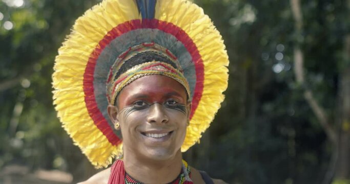 Indian from the Patax&oacute; tribe, with feather headdress. Brazilian Indian. 4K.