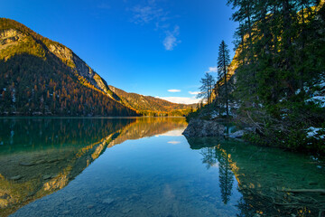 Fototapeta premium The beautiful Braies lake in late autumn with a little snow, Pearl of the Dolomite lakes is an UNESCO heritage and is located in the Braies Alto Adige,Italy