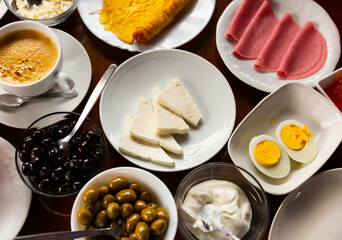 Halal breakfast at the hotel with cheese, sausage, eggs, olives, cucumbers, sauce and coffee.....