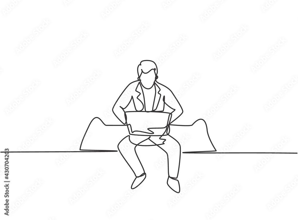 Poster single one line drawing of young business man sitting on sofa while typing business proposal on lapt
