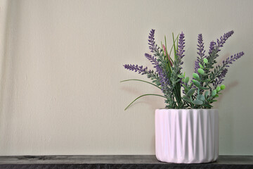 White pot with geometric lines with artificial lavender