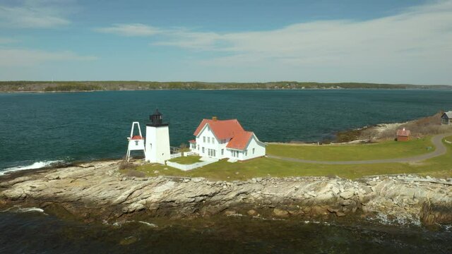 Scenic Orbiting Aerial of Hendrick's Head Lighthouse in Southport, Maine USA