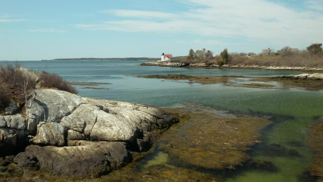 Low Angle Aerial of Hendrick's Head Lighthouse in Southport, Maine, USA