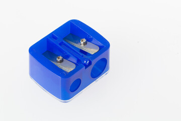 double pencil sharpener, blue color, on white background, close-up image