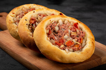 Arabic meat sfiha on the table.