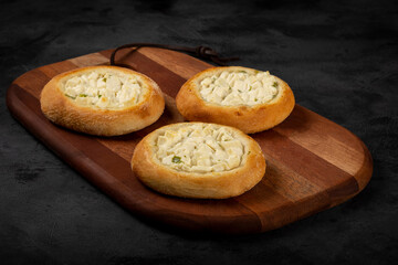 Arabic cheese sfiha on the table.