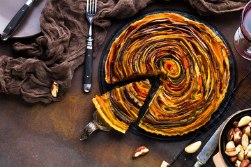 close-up view of delicious spiral vegetable tart on table - obrazy, fototapety, plakaty
