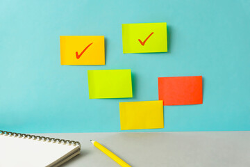 Tags which were put on the wall and check marks. Business progress, schedule, learning, business...