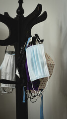 multiple face masks hanging to stroll