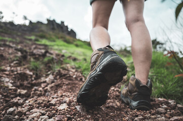 Hikers woman person with backpacks walking and travel to the mountain nature outdoor, adventure hiking sport lifestyle for trekking tourist activity, summer vacation journey to freedom relaxation