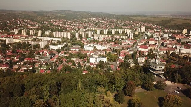 Cinematic aerial drone dolly footage of the Avas TV Tower in Miskolc, fourth largest city and a major industrial hub, Northern regional center of Hungary, capital of Borsod-Aba&uacute;j-Zempl&eacute;n county