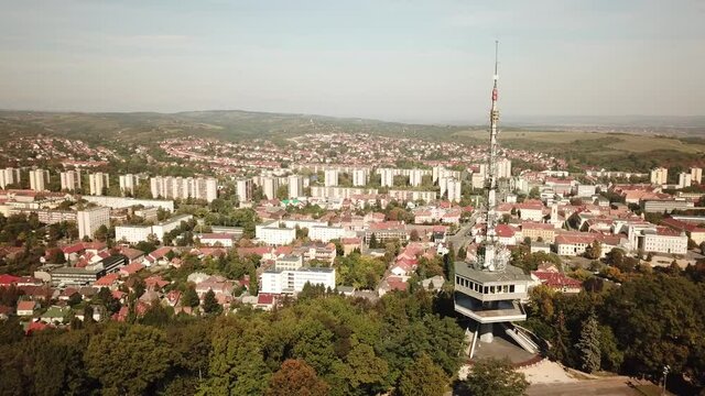 Cinematic aerial drone orbiting footage of the Avas TV Tower in Miskolc, fourth largest city and a major industrial hub, Northern regional center of Hungary, capital of Borsod-Aba&uacute;j-Zempl&eacute;n county