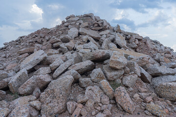 Concrete debris pile mountain in the construction site with blue sky background