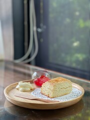 Top view closed up of Plain scone with fruit jam on wood table. Cafe concepta