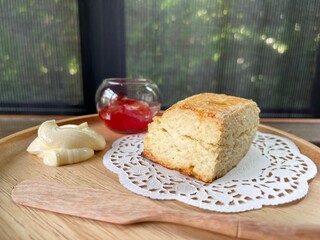 Top view closed up of Plain scone with fruit jam on wood table. Cafe concepta