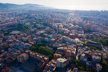 Fototapeta na wymiar Aerial view of Santa Coloma de Gramenet with a apartment buildings and Besos river, Spain