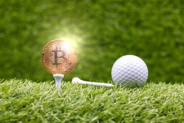 Bitcoin with golf are on green grass