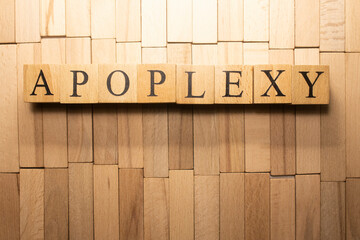 The word Apoplexy was created from wooden cubes. Health and life Close up.