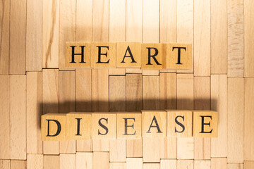 Heart disease word was created from wooden cubes. Health and life. Close up.