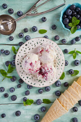 blueberry ice cream on turquoise surface