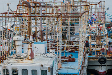 Equipment cages on top of ocean fishing trawlers