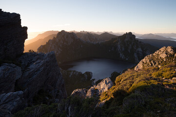 Fototapeta na wymiar Sunrise over Lake Oberon and the Western Arthur Range. Southwest National Park, Tasmania. World Heritage Area
