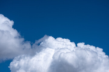 cumulus clouds in the blue sky