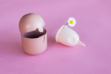 menstrual cup on pink background