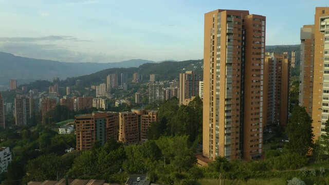 Slow Pull Away from Tall Apartment Buildings in Colombia