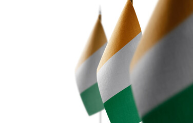 Small national flags of the Cote dIvoire on a white background