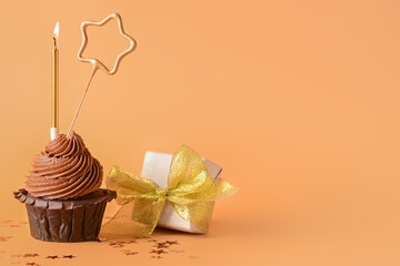 Tasty chocolate cupcake on color background