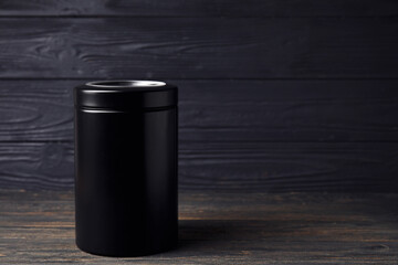 Mortuary urn on dark wooden background