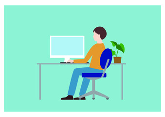 パソコンに向かって仕事をしている男性