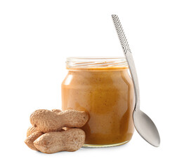 Jar and spoon with tasty peanut butter and nuts on white background
